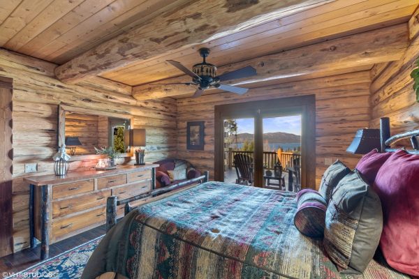 Master Bedroom with a Ceiling Fan and a Deck with Lake Views